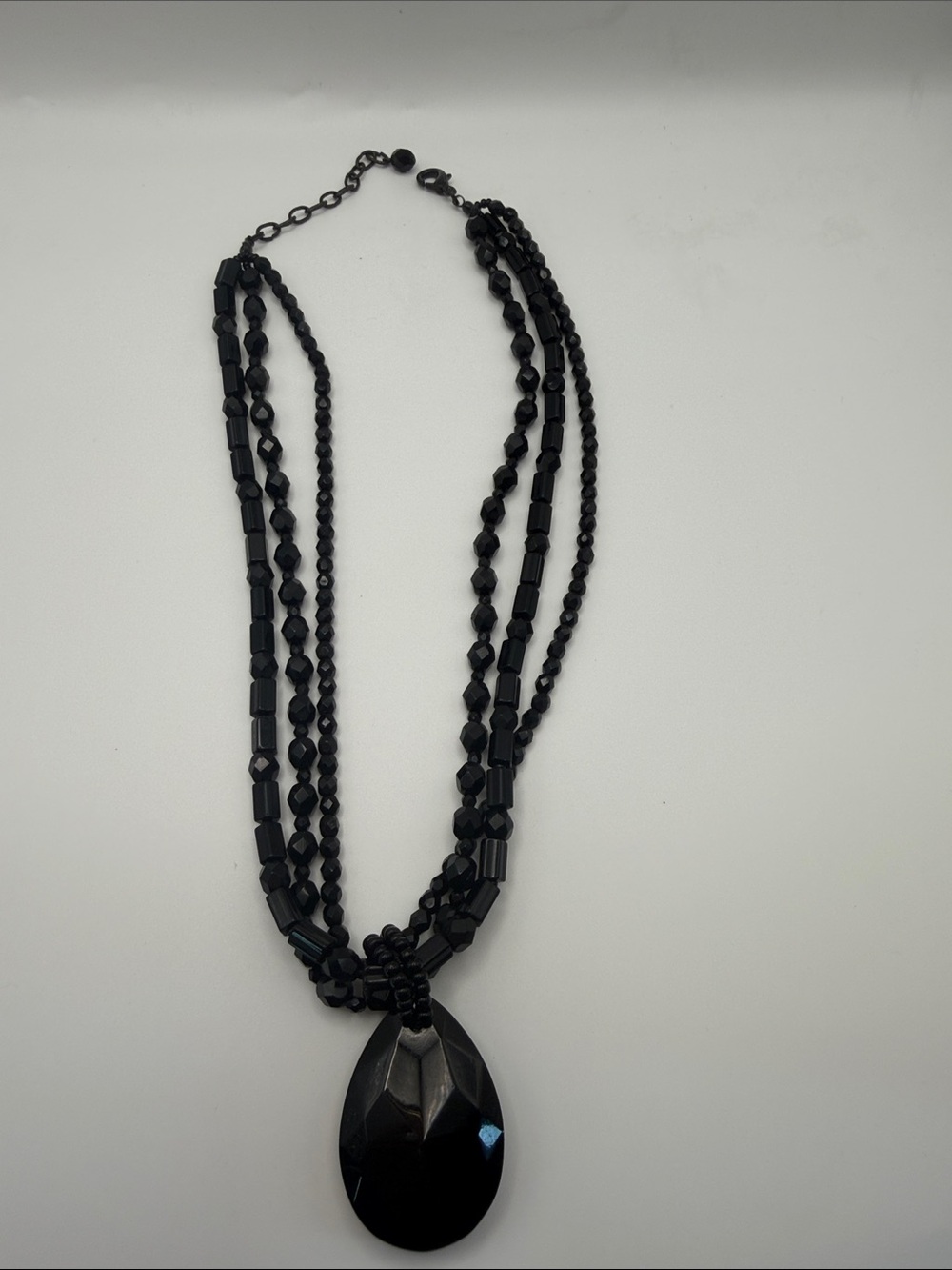 Black Multi-Strand Beaded Necklace with Faceted Teardrop Pendant